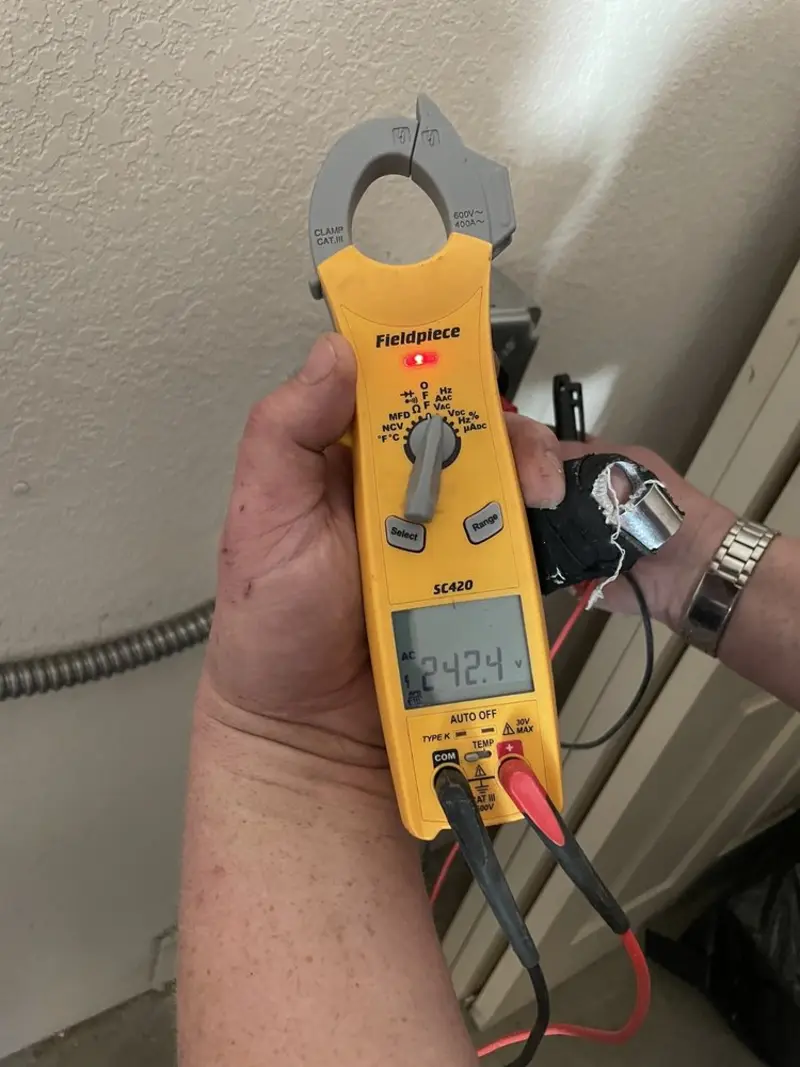 Voltage testing with clamp meter during Recessed Lighting Installation in Upper